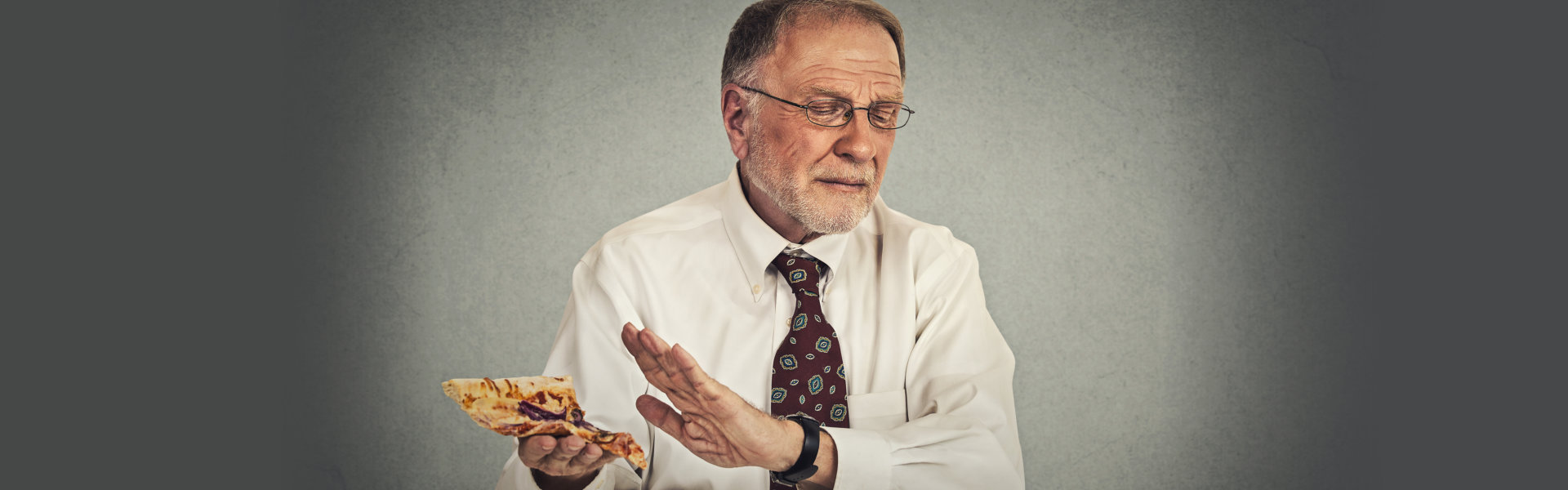 man avoiding fatty pizza